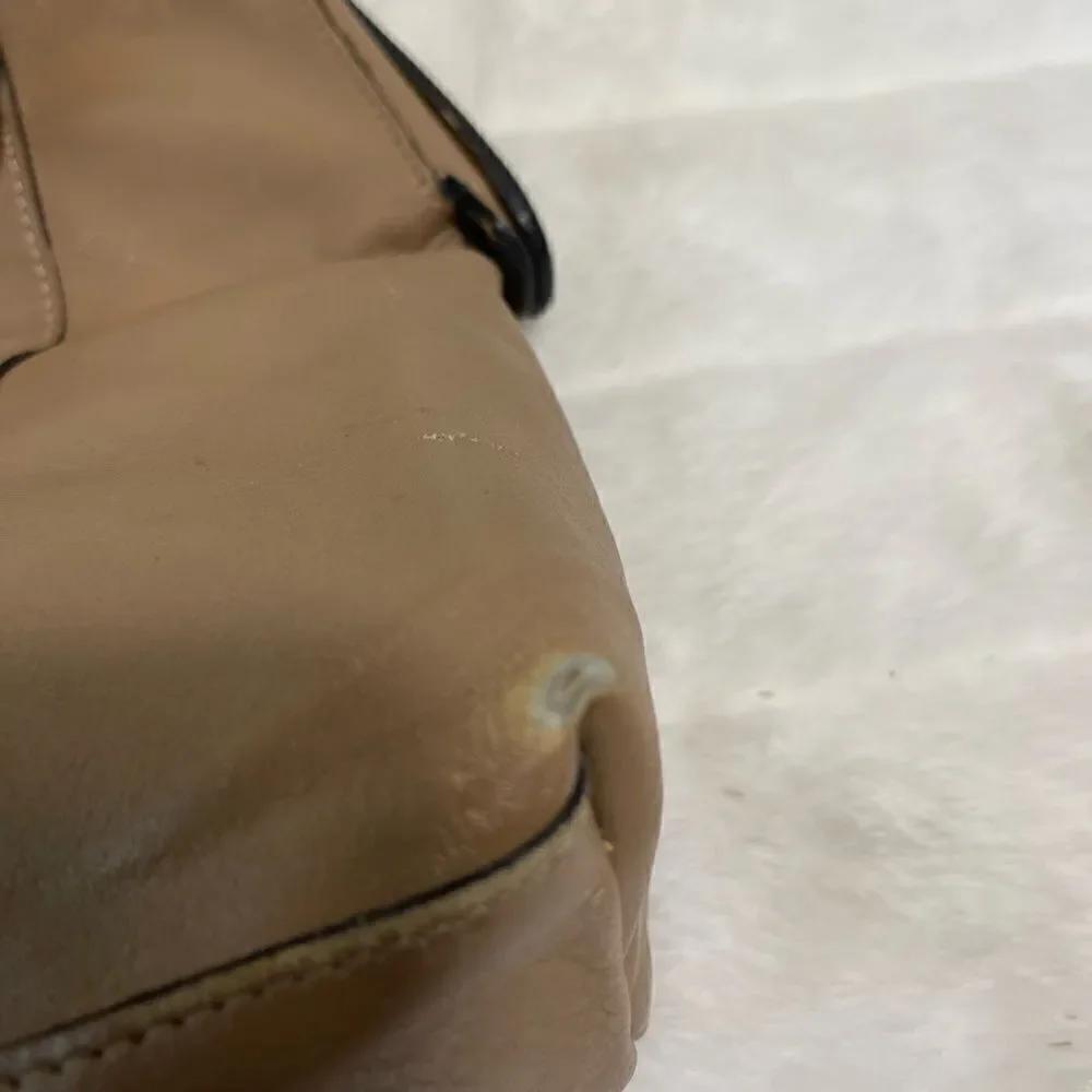 Tano Leather tan frame medium satchel gold tone hardwares .